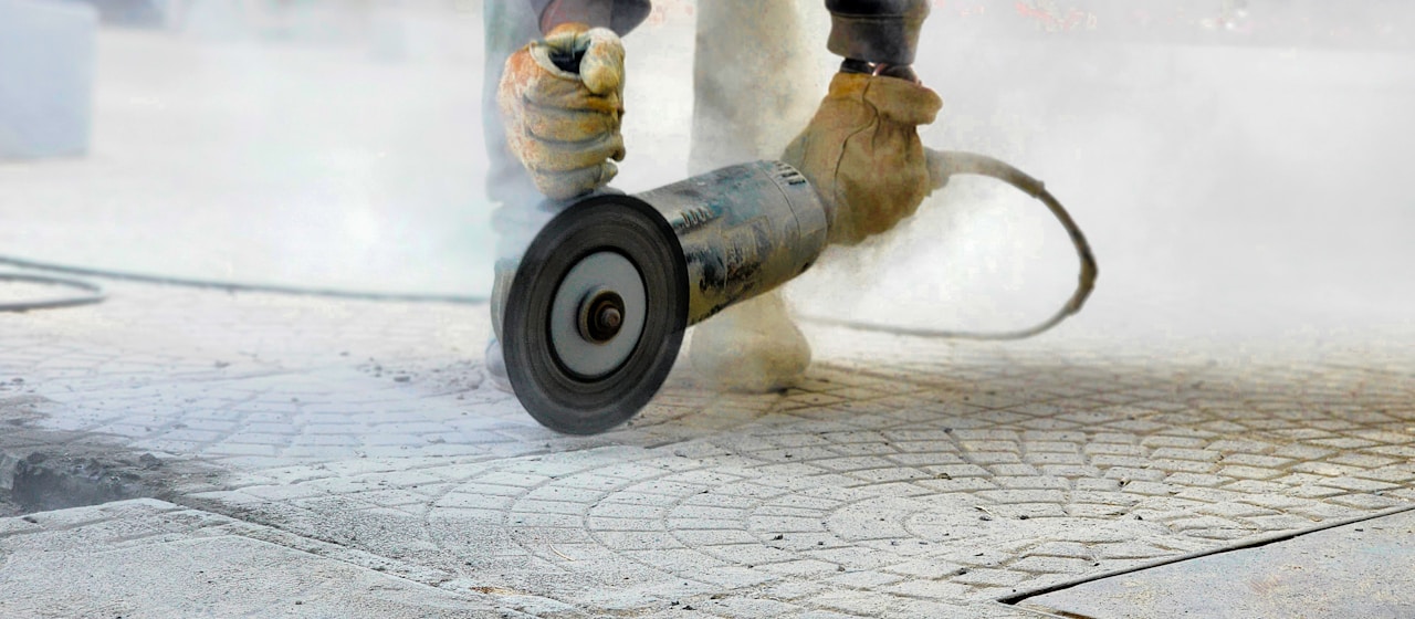 Diamond blade cutting through concrete floor slab